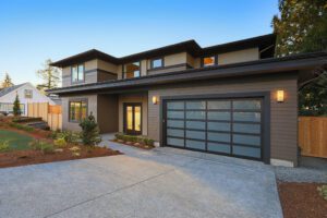Modern two-story home with sleek siding and a spacious driveway, showcasing the expert remodeling craftsmanship of Bayside Builders Group in the Bay Area.
