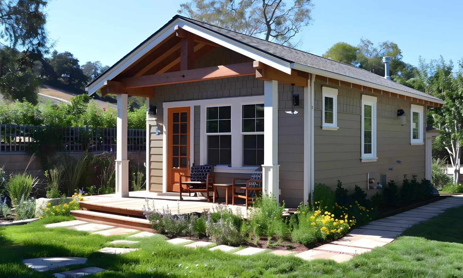 A beautifully constructed ADU with a porch set in a lush garden, showcasing Bayside Builders Group's expertise in home renovations and expansions in the Bay Area.